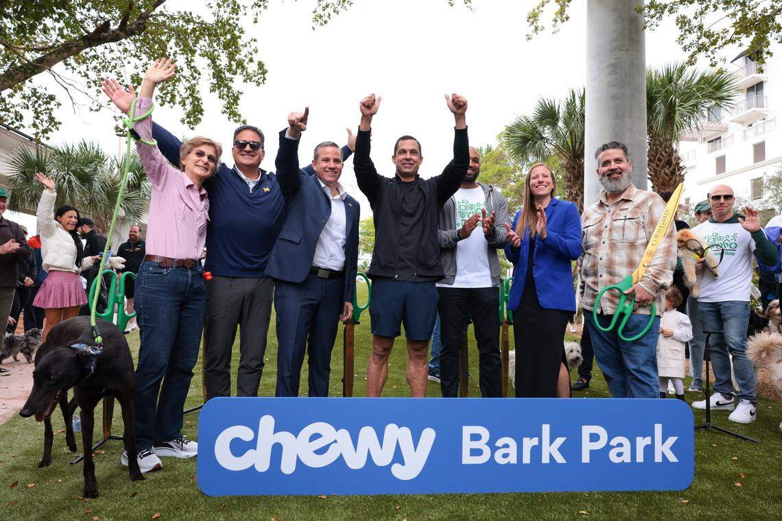 Coral Gables Mayor Vince Lago, center, vice mayor, Rhonda Anderson, far left, Miami-Dade County Tax Collector Dariel Fernandez, third from left, in partnership with leadership from Friends of The Underline and Chewy, celebrate the grand opening of the Chewy Bark Park at 4579 Ponce de Leon Blvd. on Saturday, Jan. 31, 2026, in Coral Gables, Fla. 