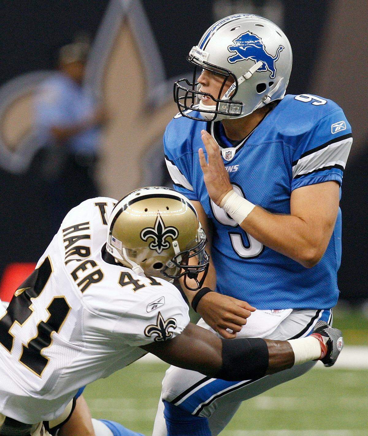 ** ADDS FIRST HALF **New Orleans Saints safety Roman Harper (41) hits Detroit Lions quarterback Matthew Stafford (9) as he throws a pass in the first half of an NFL football game in New Orleans, Sunday, Sept. 13, 2009. (AP Photo/Bill Haber)