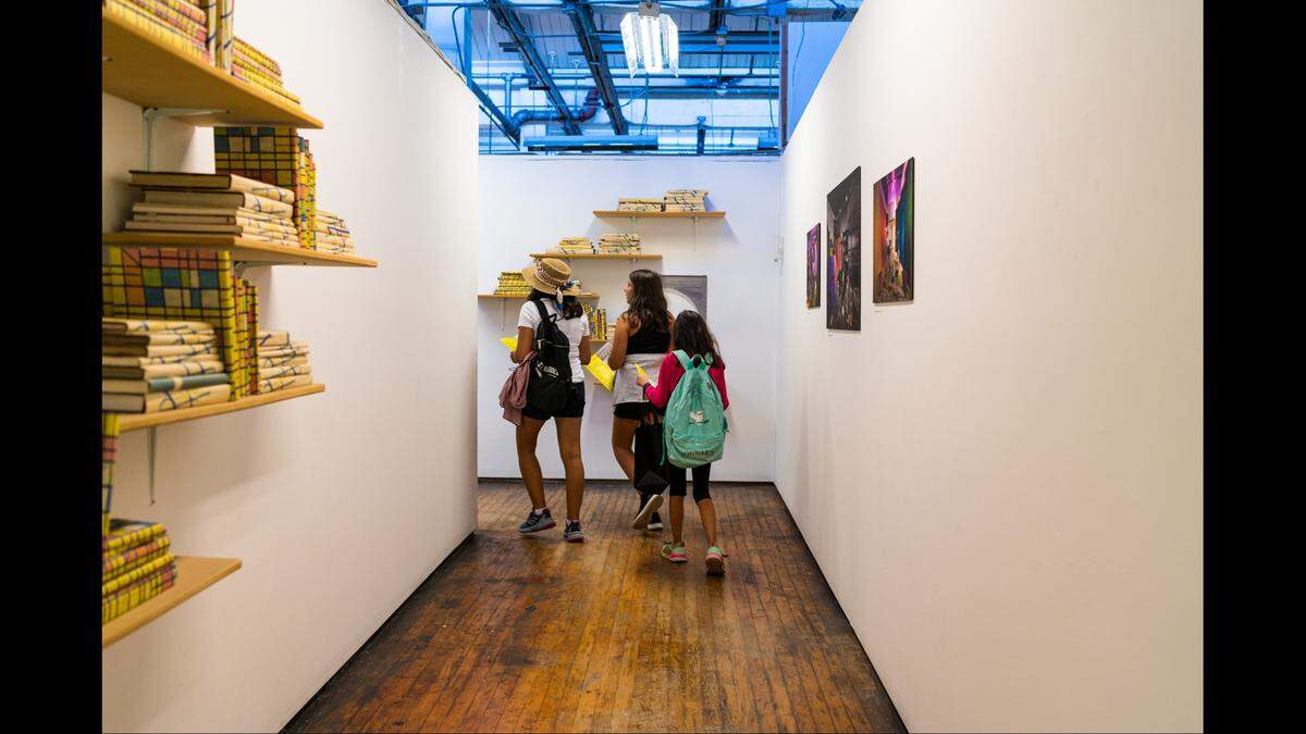 Kids explore at the Bakehouse Art Complex in the first Adventure-Leggers event to expand literature, art, and creative entrepreneurship for children. Host Bookleggers Library plans to make this an annual event.