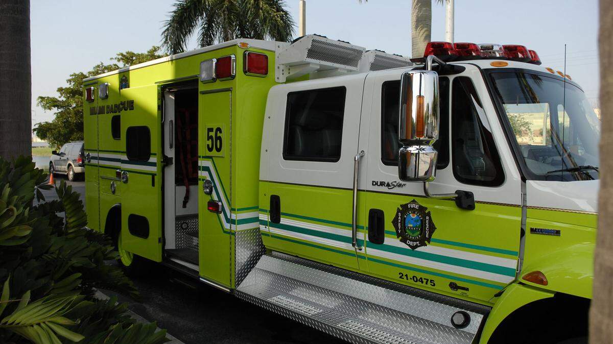 Miami-Dade Fire Rescue took Alex Paul and Andrew Paul to a hospital after they were pulled out of the lake at Arthur Woodard Park.