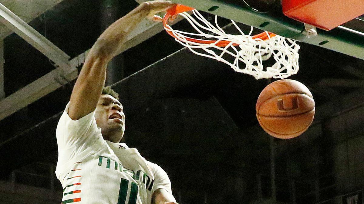 The Miami Hurricanes’ Anthony Walker (11) dunks during Um’s game against Boston College on Wednesday.