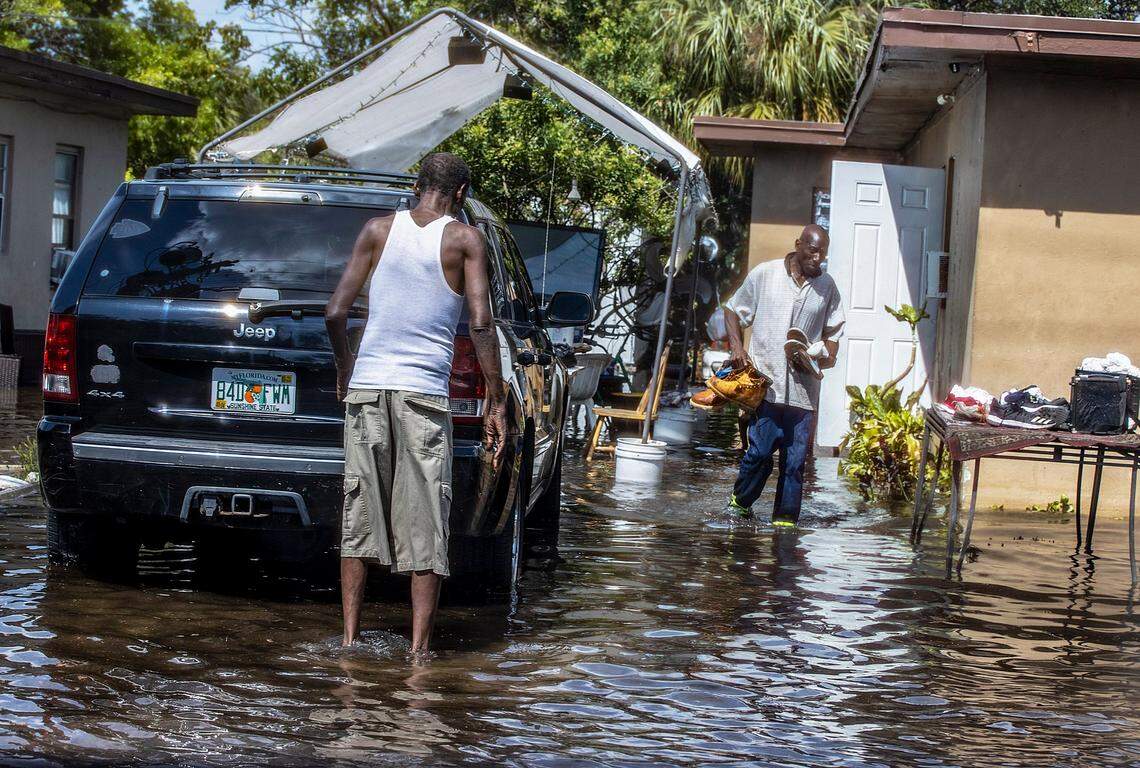 Residents at Northwest 16th Avenue and Sunrise Boulevard get their belongings out of their house on Thursday April 13, 2023, as many Fort Lauderdale streets remained flooded due to the heavy rains in Broward County. Fort Lauderdale got more than 2 feet of rain on Wednesday, April 12, 2023..