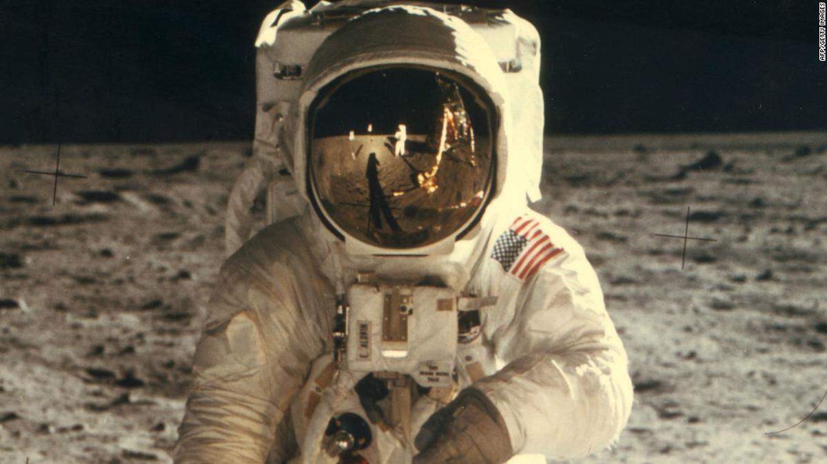 Astronaut Neil Armstrong is seen in the reflection in the visor of Edwin “Buzz” Aldrin’s helmet.