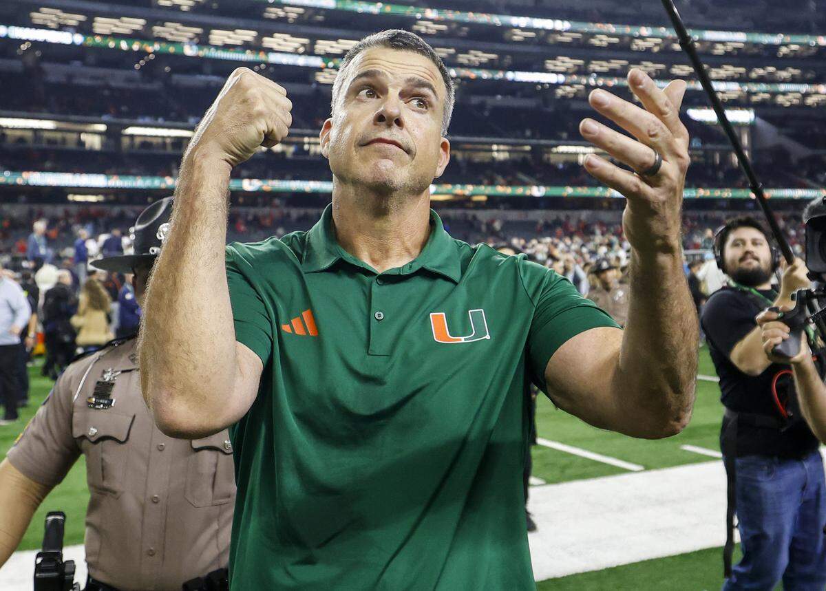 Miami Hurricanes head coach Mario Cristobal reacts after the Canes defeat the Ohio State Buckeyes during the College Football Playoff quarterfinal game in the Cotton Bowl at AT&T Stadium in Arlington, Texas on Wednesday, December 31, 2025.