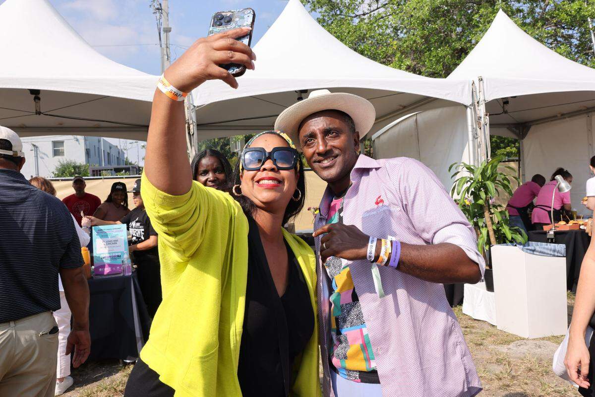 Red Rooster founder Marcus Samuelsson poses for a selfie at the Overtown EatUp! in 2023. The Cookout and the Overtown EatUp! are part of the South Beach Food and Wine Festival’s commitment to highlight Black chefs.