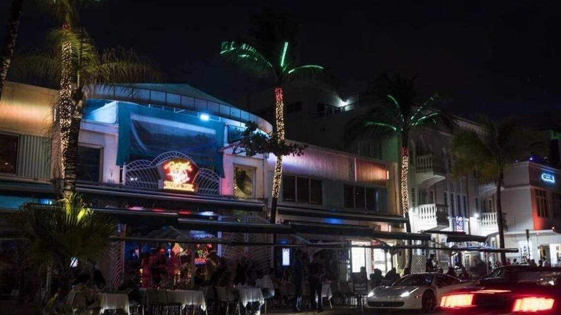 An image of Ocean Drive at night with two lanes of traffic.