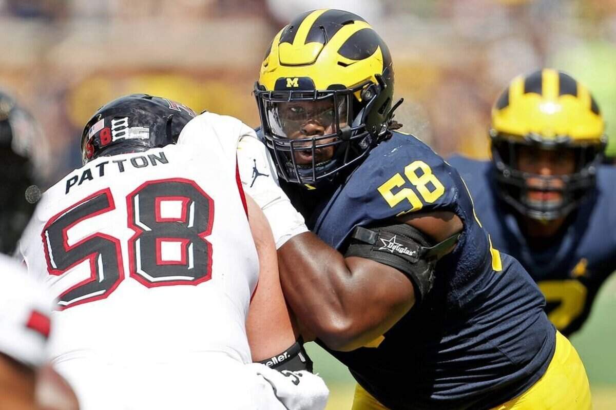 Michigan defensive lineman Mazi Smith (58) tries to get into the backfield against Northern Illinois offensive lineman Brayden Patton (58) in the second quarter of their college football game against Northern Illinois at Michigan Stadium in Ann Arbor, on Saturday, September 18, 2021. (Mike Mulholland | MLive.com)