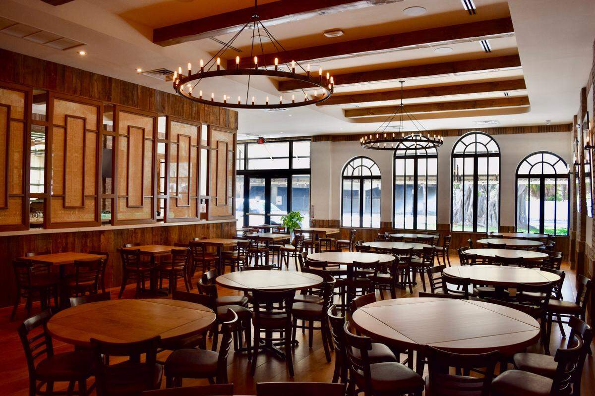 Walls of the new Perricone’s restaurant include wood reclaimed from the original restaurant — which came from a 1700s Vermont barn.