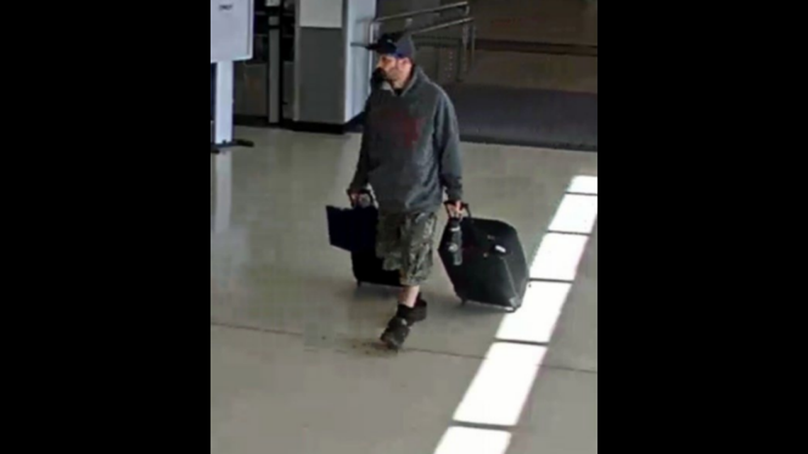The FBI says this photo shows Marc Muffley, 40, with two suitcases at the Lehigh Valley International Airport in Pennsylvania on Feb. 27, 2023.