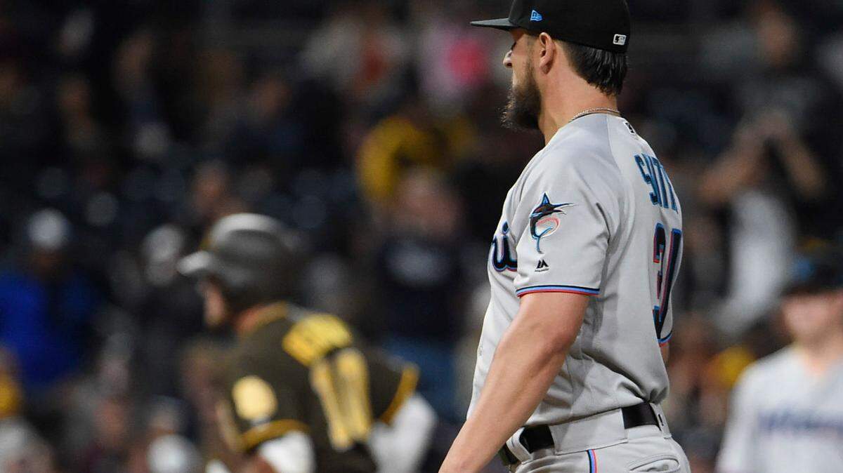 Caleb Smith of the Miami Marlins stands in the infield after giving up a solo home run to Hunter Renfroe of the San Diego Padres during the fourth inning of a baseball game at Petco Park May 31, 2019 in San Diego, California.