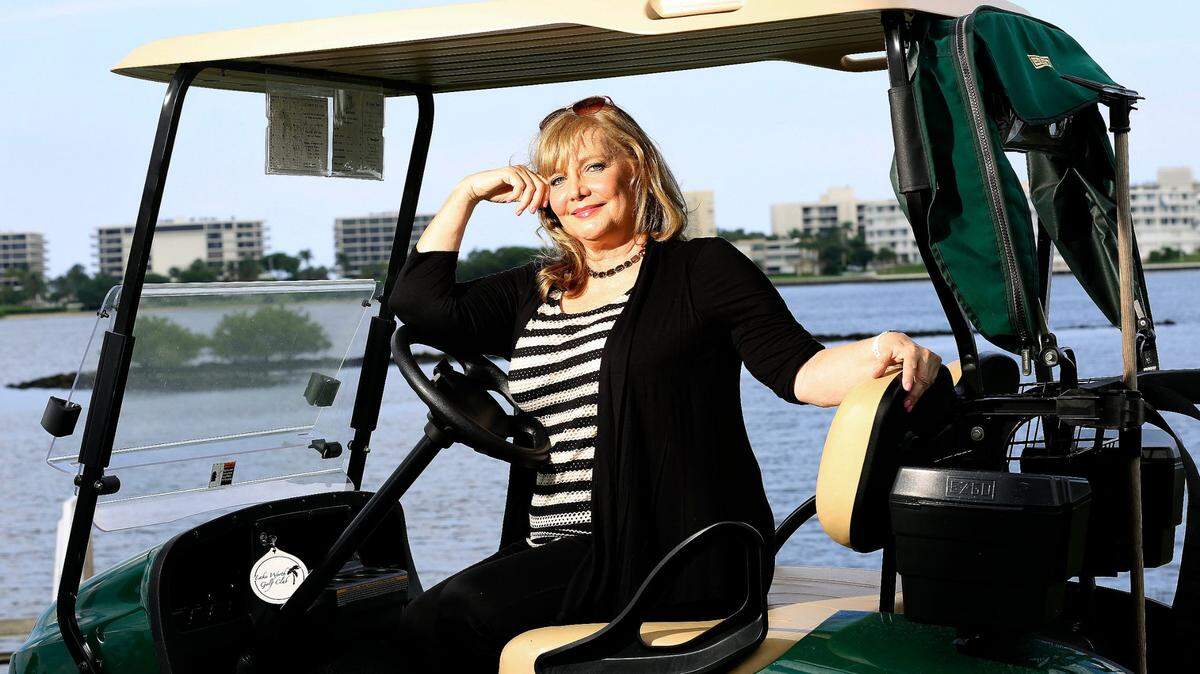 Cindy Morgan, actor, and member of the cast of the classic comedy movie Caddyshack, poses in October 2015 at the Lake Worth Municipal Golf Course in Lake Worth. Morgan died in late December at her home in Lake Worth Beach.