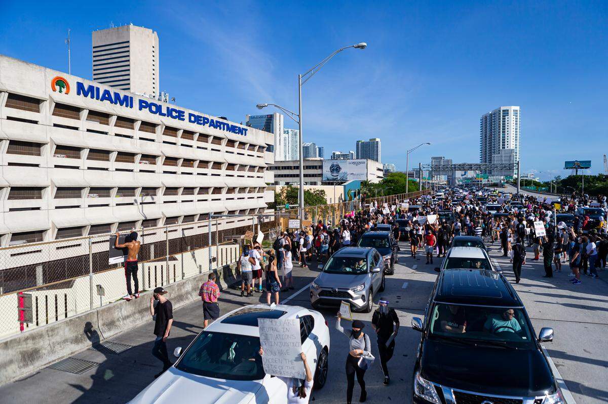 Activists make their way onto Interstate 95 during a ‘Justice for George Floyd’ protest in downtown Miami.