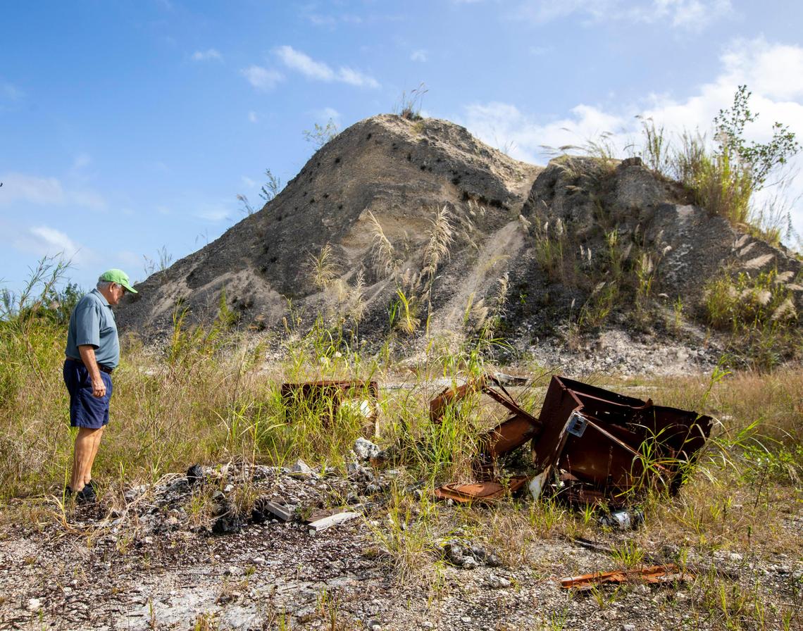 Julio Lago stands in an area in the back of the Keys Gate Golf Course where people have taken to shooting guns.