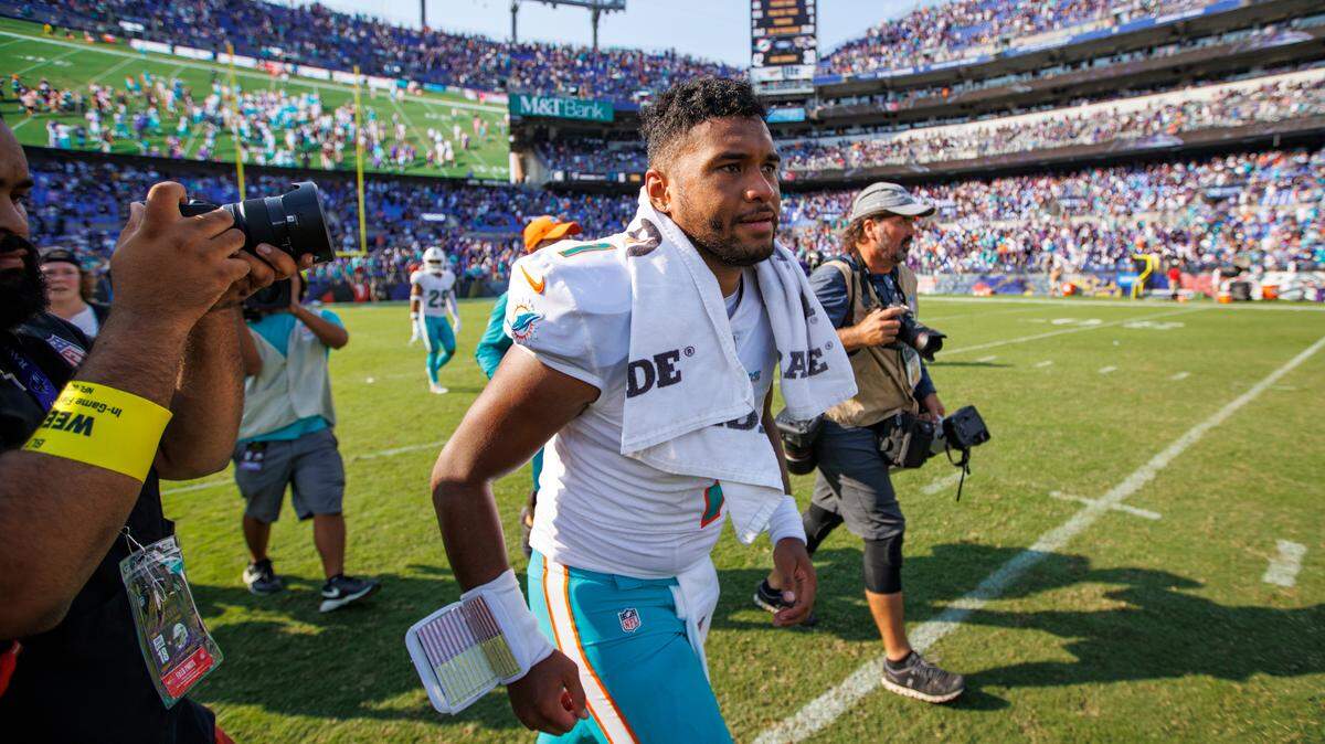 Miami Dolphins quarterback Tua Tagovailoa (1) trots off field after 42-38 win over Baltimore Ravens in NFL football game at M&T Bank Stadium on Sunday, September 18, 2022 in Baltimore, MD.