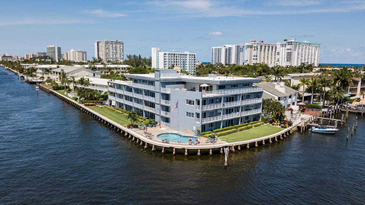 The Chicago-based Uniform Law Commission is drafting model legislation to remove racial discriminatory and restrictive covenants in deeds across the country. Above: An aerial view of real estate properties off Lake Santa Barbara in Pompano Beach, Florida on Monday, April 26, 2021.