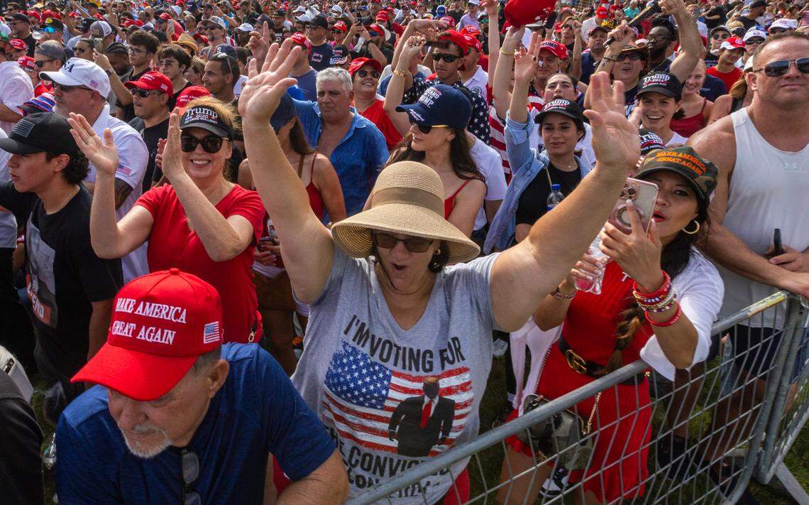 Trump supporters react during a rally at Trump National on Tuesday, July 9, 2024, in Doral, Fla.