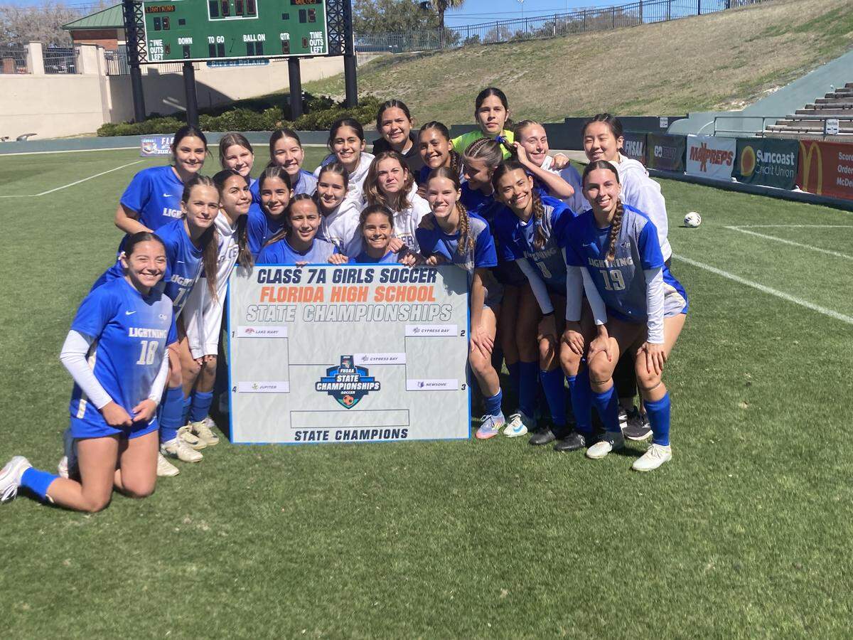 Cypress Bay girls’ soccer players celebrate at SpecMartin Stadium in DeLand, Fla. after beating Lithia Newsome and putting their school’s name on the state final spot of the Class 7A state bracket.