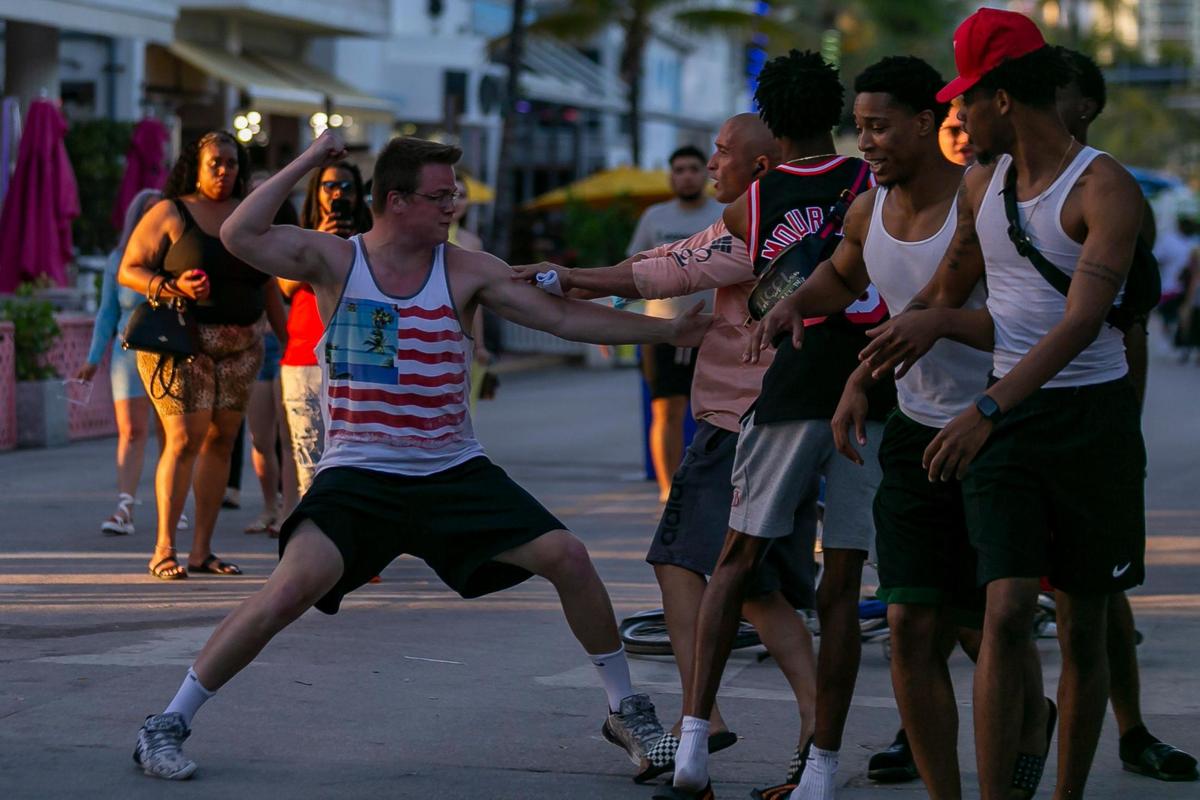 A fight breaks out on Ocean Drive during Spring Break in Miami Beach, Florida on Friday, March 26, 2021.