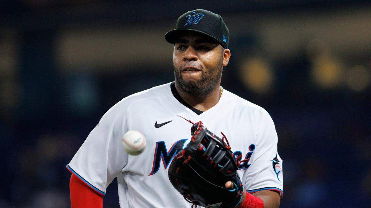 Miami Marlins first baseman Jesus Aguilar (99) catches a baseball as he walks to the dugout after finishing the third inning of a baseball game against the Pittsburgh Pirates at LoanDepot Park on Wednesday, July 13, 2022 in Miami, Florida.