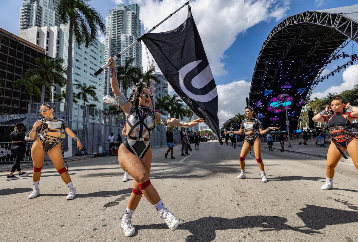 Performers dance on Biscayne Boulevard as the gates open for Ultra Music Festival’s 25th anniversary at Bayfront Park, in Miami, Florida, on Friday, March 28, 2025.