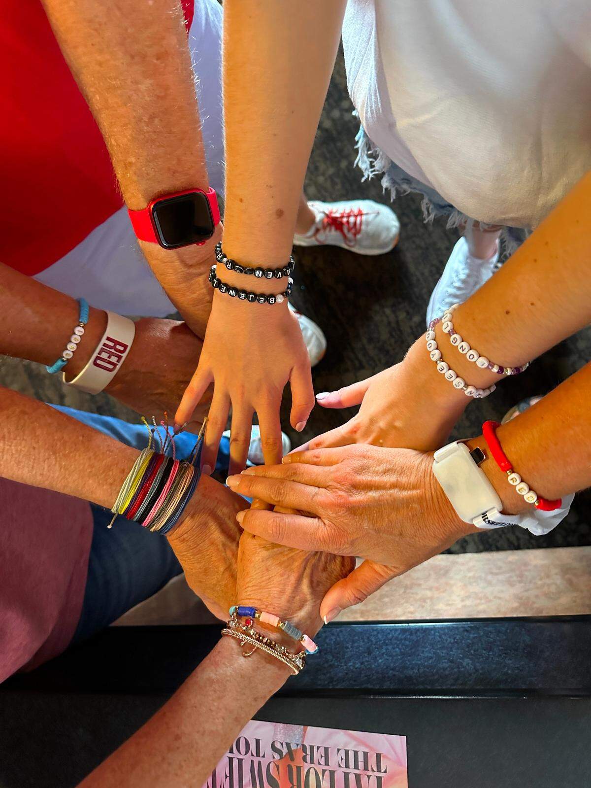 Taylor Swift fans take the traditional friendship bracelet selfie at a screening of the superstar’s concert movie, “Taylor Swift: The Eras Tour” at AMC Sunset Place on Oct. 15, 2023.