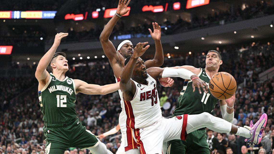 Apr 26, 2023; Milwaukee, Wisconsin: Miami Heat center Bam Adebayo (13) and Milwaukee Bucks center Brook Lopez (11) battle for a rebound during Game 5 of the 2023 NBA Playoffs at Fiserv Forum in Milwaukee.