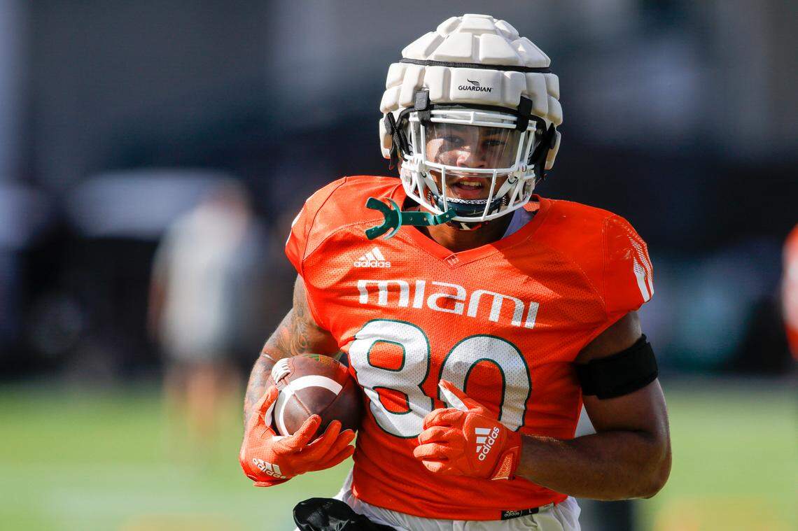 Miami Hurricanes tight end Elijah Arroyo (80) runs with the football during football practice at the University of Miami campus in Coral Gables, Florida, Tuesday, August 23, 2022.