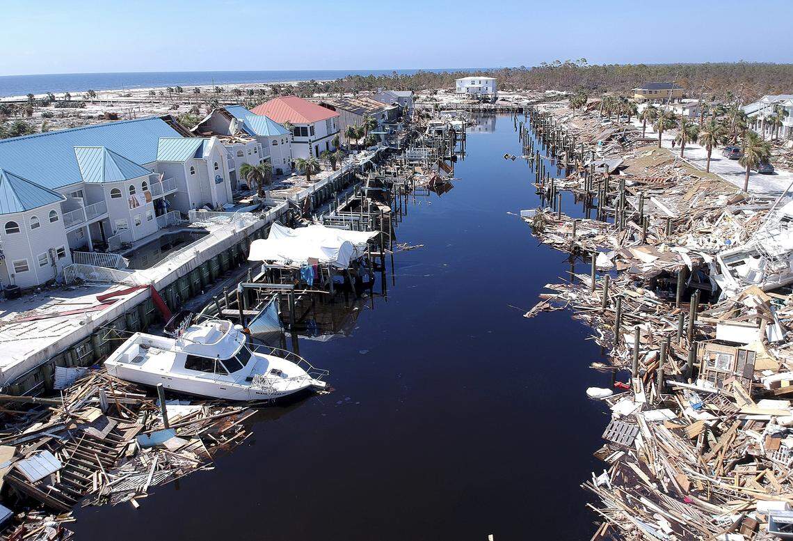 Debris litters a canal in Mexico Beach on Monday.