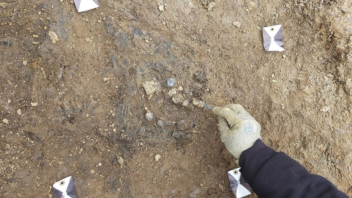 Archaeologists in Northamptonshire uncovered a 1,300-year-old gold necklace, the Harpole treasure, in the grave of an elite medieval woman.