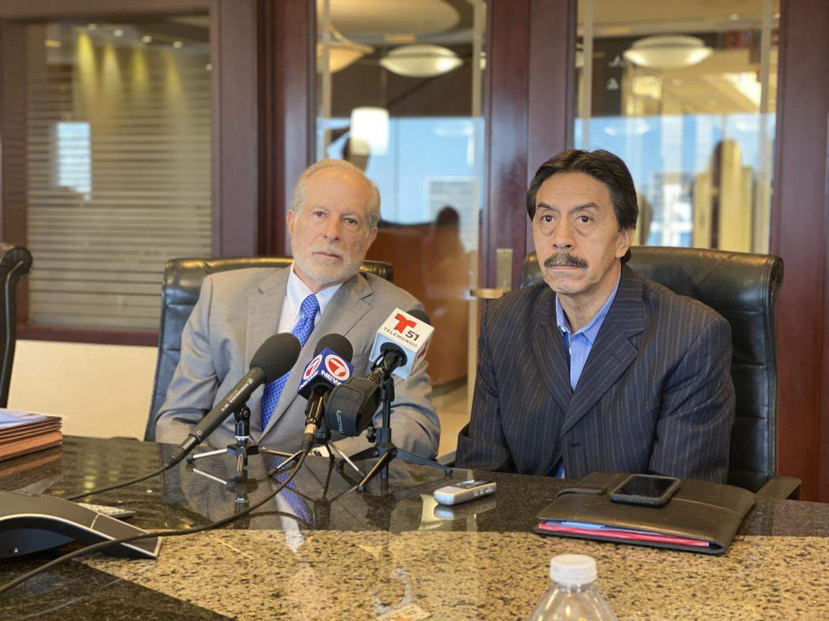 Alan Goldfarb, left, and Orlando Duran spoke with reporters in Miami following a National Transportation Safety Board hearing on Wednesday, Oct. 22. Goldfarb is representing the Duran family, who lost their daughter Alexa in the collapse.