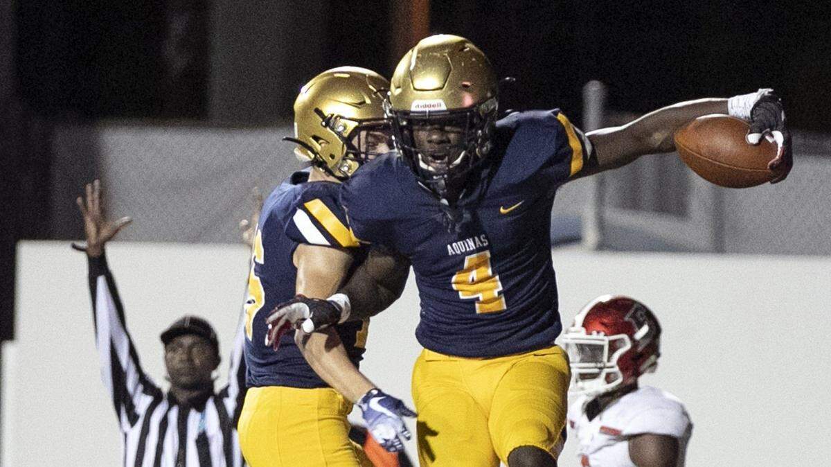 St. Thomas Aquinas wide receiver Marcus Rosemy (4) celebrates his late fourth-quarter touchdown as the Raiders defeated Edgewater Eagles in the Class 7A FHSAA State Championship at Daytona Stadium in Daytona Beach on Dec. 14, 2019. He signed with the University of Georgia.
