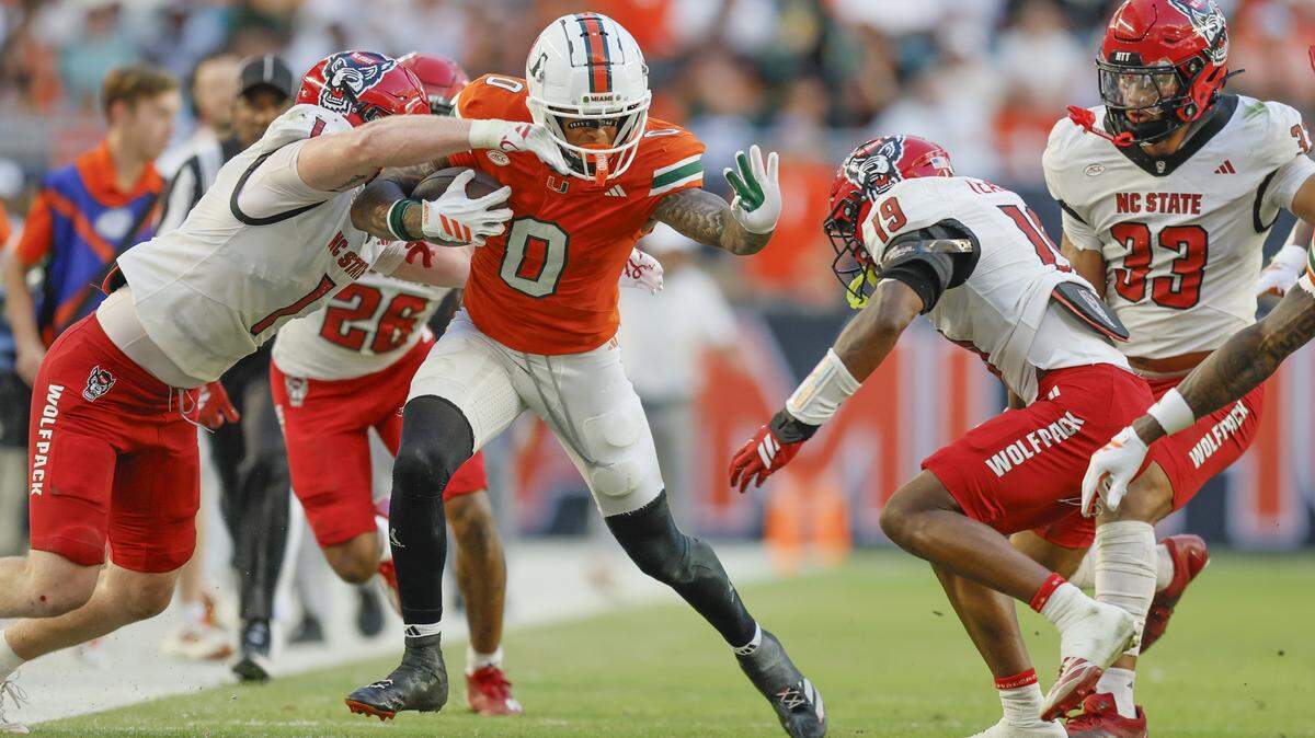 Miami Hurricanes wide receiver Keelan Marion (0) on a first down pass reception in the first half of an NCAA football game against the NC State Wolfpack at Hard Rock Stadium in Miami Gardens, Florida, on Saturday, November 15, 2025.