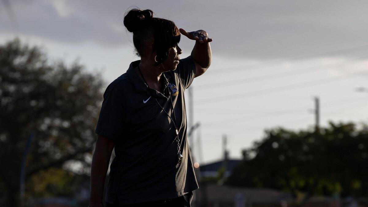 Miami Northwestern Senior High track and field coach Carmen Jackson watches her students run drills during a recent practice at their school. Under Jackson’s leadership, the Bulls have won 18 state championships.