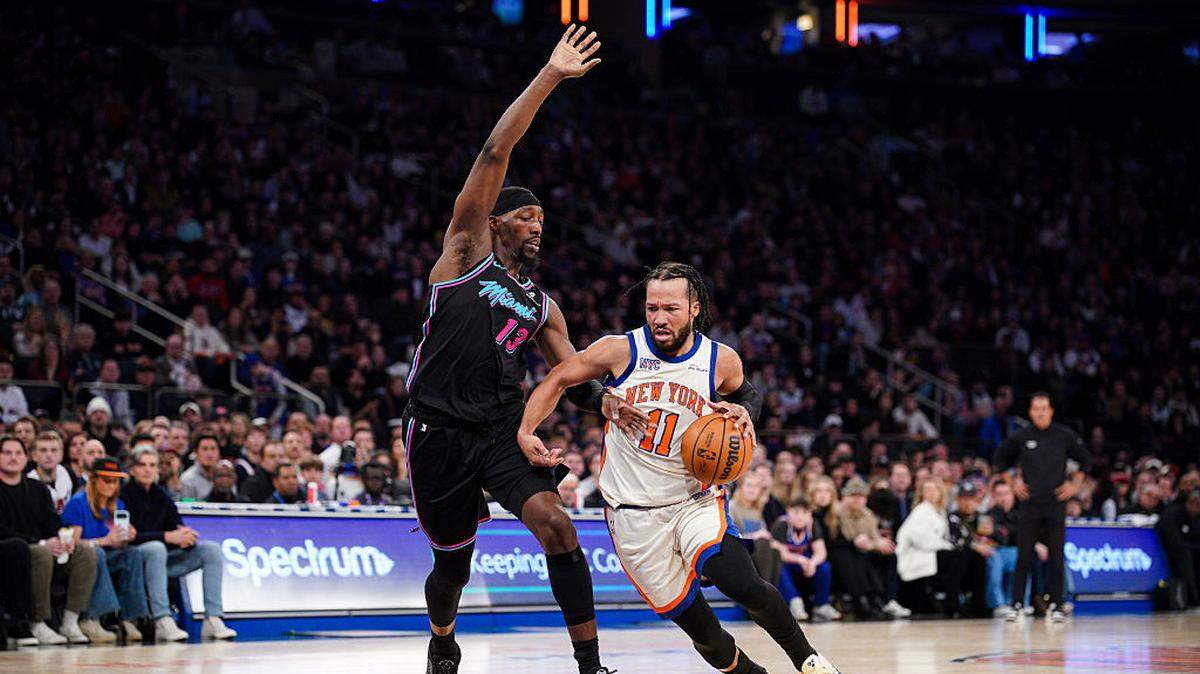Jalen Brunson #11 of the New York Knicks goes to the basket as Bam Adebayo #13 of the Miami Heat defends in the first half at Madison Square Garden on December 21, 2025 in New York City.