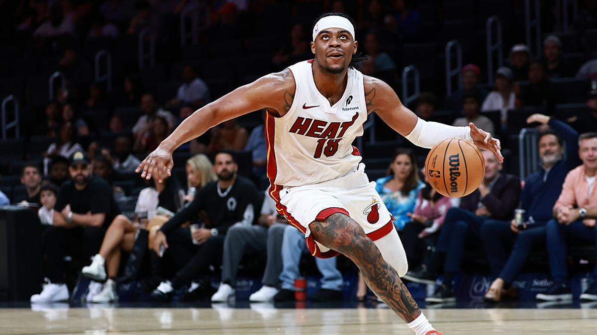 Trevor Keels of the Miami Heat drives to the net against the Milwaukee Bucks during the second half at Kaseya Center on October 06, 2025 in Miami, Florida.