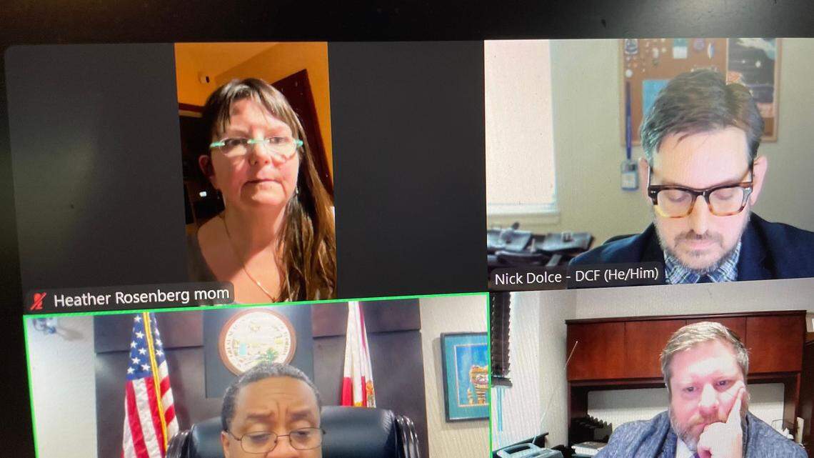 Heather Rosenberg, upper left, appears via Zoom during a child custody hearing late Wednesday in Tallahassee. The former Department of Children and Family Services watchdog was fighting a move by the agency to take custody of one of her adopted children in a dispute over in-home assistance. Upper right is DCF attorney Nick Dolce, Lower left is Judge Anthony Miller. Bottom right is Ryan Osborne, an attorney for the state guardian-ad-litem program.