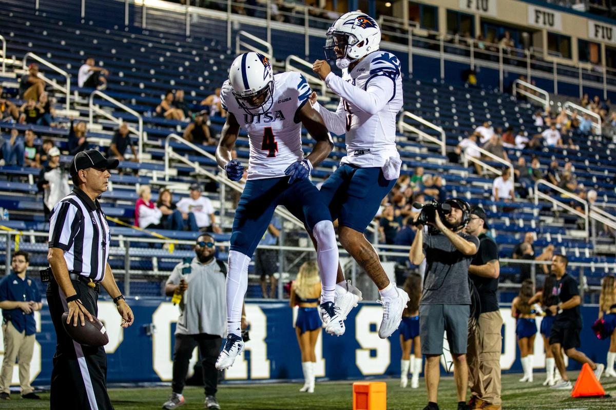 Texas San Antonio wide receiver Zakhari Franklin (4) reacts with a teammate after scoring against Florida International University during the first half of a NCAA Conference USA football game at Riccardo Silva Stadium in Miami, Florida, on Thursday, September 1, 2022.
