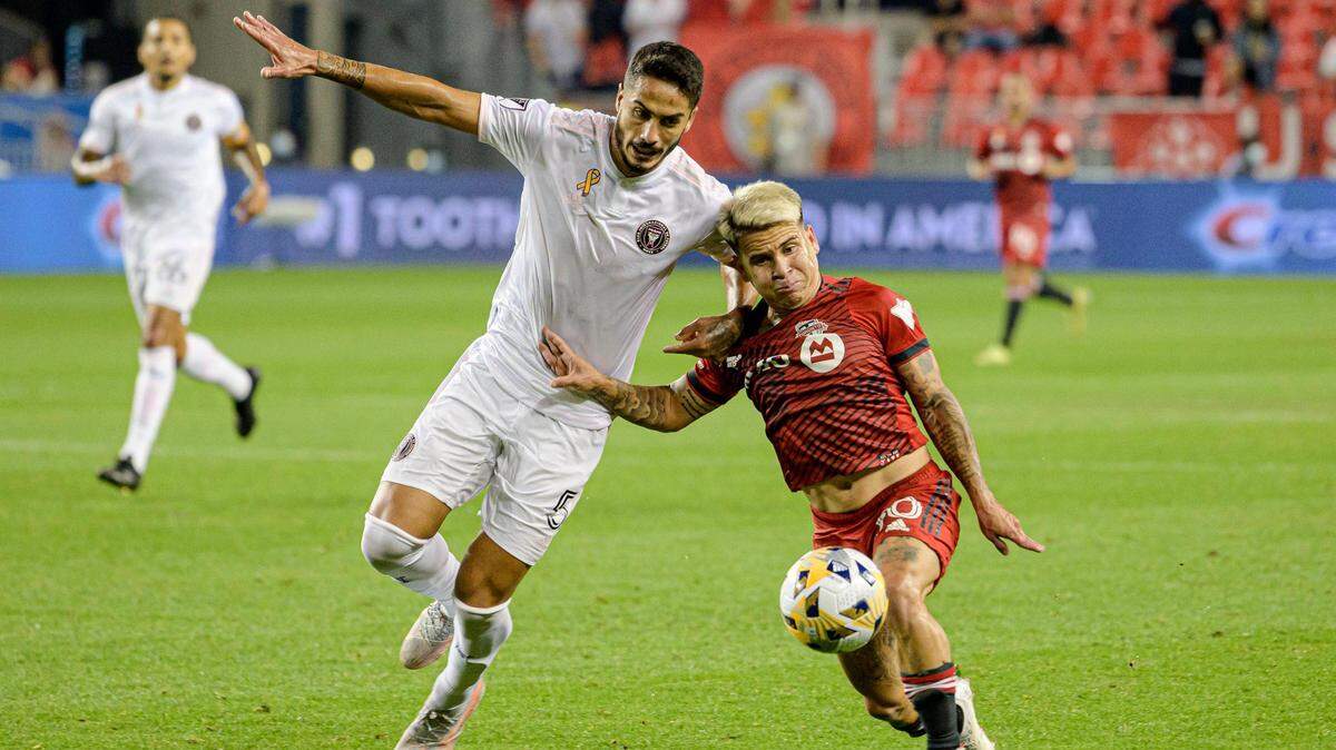 Inter Miami defender Nicolas Figal, left, vies for position with Toronto FC midfielder Yeferson Soteldo during the first half Tuesday. Miami won 1-0 on a stoppage time penalty kick by Christian Makoun.
