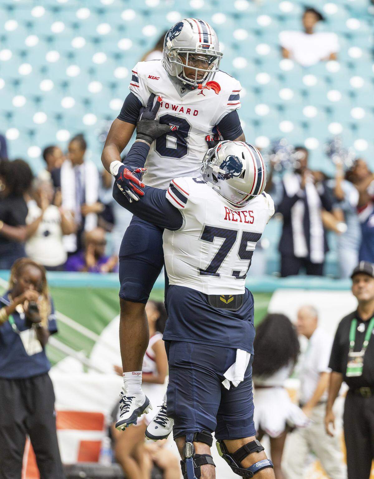 Howard Bison wide receiver CJ Neely (8) celebrates with offensive lineman Cesar Reyes (75) after scoring a touchdown against Florida A&M Rattlers in the first half of their Orange Blossom Classic football game at Hard Rock Stadium on Saturday, Aug. 30, 2025, in Miami Gardens, Fla.