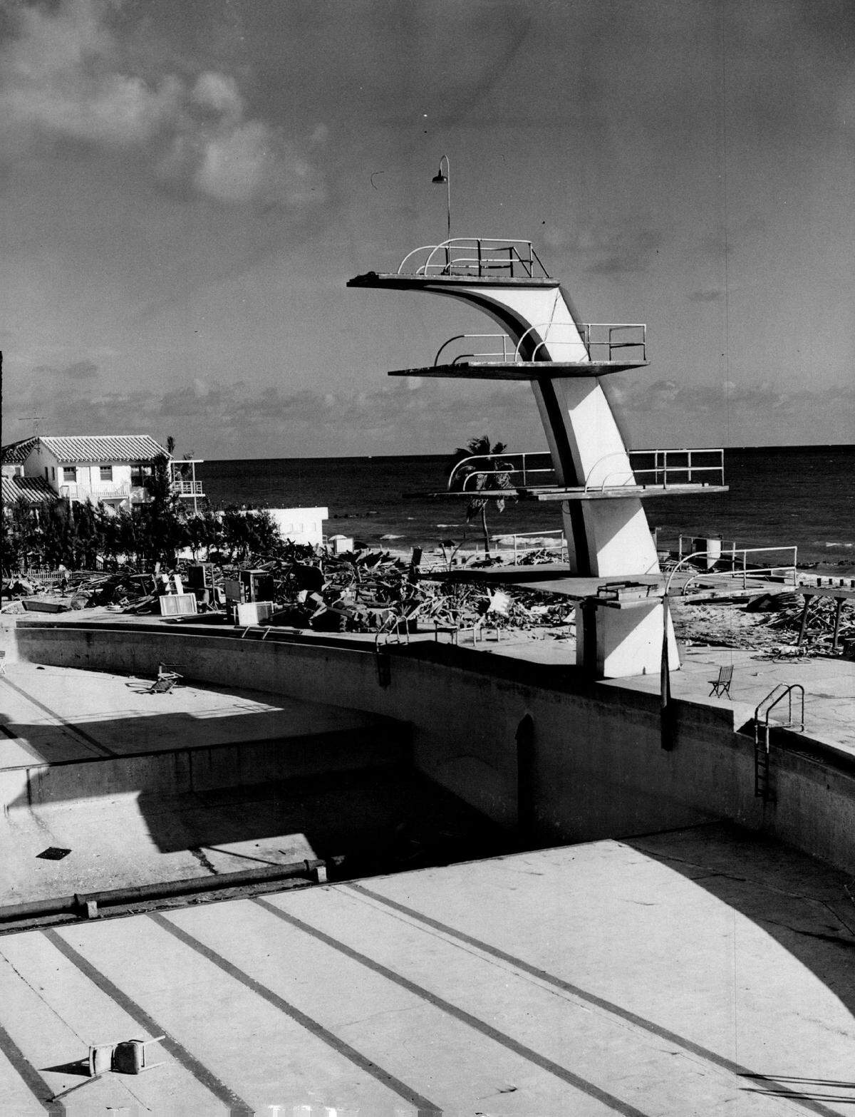 LAST LOOK at the McFadden Deauville hotel swimming pool, something of a landmark on Miami Beach is afforded here. This was the first Olympic-sized States. Pete Desjardins, Miami’s first Olympian, trained in it. Now the hotel is being torn down to make way for a new one.