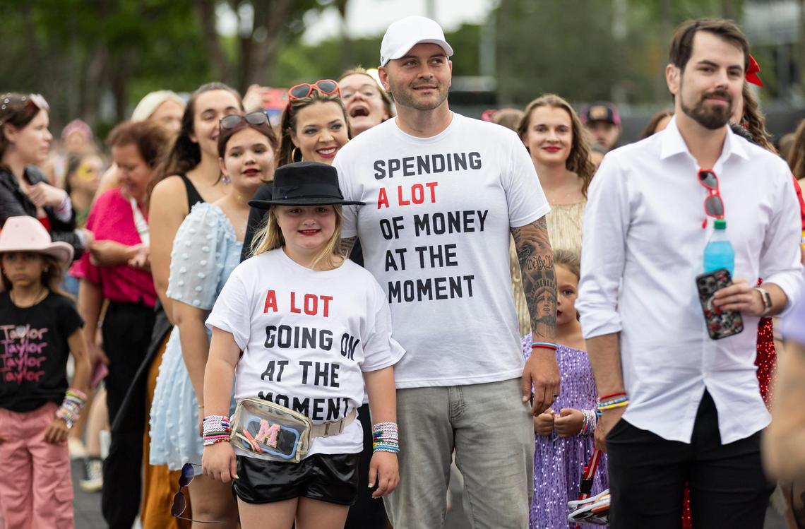 Melina and Justin Rogerson, from Cleveland, Ohio, wait in line to watch Taylor Swift’s The Eras Tour on Friday, Oct.18, 2024, in Miami Gardens, Fla.