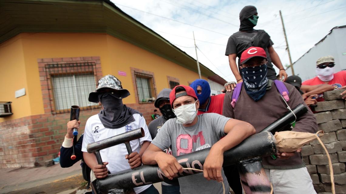 A group of young protesters defends a roadblock in Masaya, Nicaragua on June 6, 2018.