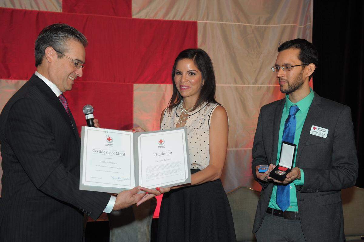 Pamela Rauseo is honored during the prestigious 21st annual Sara Hopkins Woodruff Spectrum Awards For Women held by The American Red Cross South Florida Region at the Ritz-Carlton Key Biscayne in April 2014. Rauseo, who made headlines around the world when, on a busy Miami highway, she performed CPR learned through the Red Cross to save her 5-month-old nephew Sebastian de la Cruz, was given the highest honor during the luncheon ceremony. Alfred Sanchez, executive director of the American Red Cross Greater Miami & The Keys Chapter presented her with the Presidential Medal and Certificate of Merit.