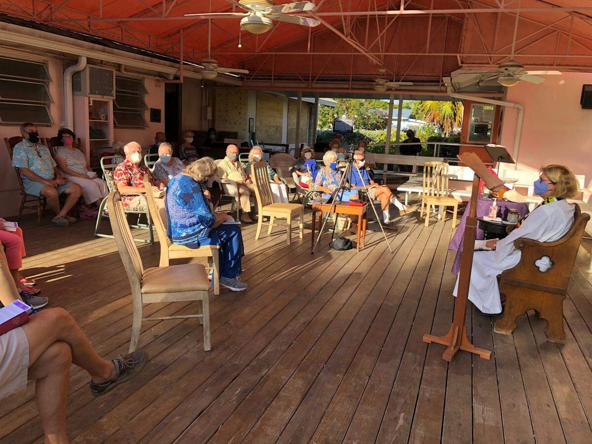 Rev. Debra Maconaughey of the St. Columba Episcopal Church in Marathon leads a Sunday service on the church’s outside pavilion on March 14th, 2021. The church’s main sanctuary is still damaged from Hurricane Irma in 2017.