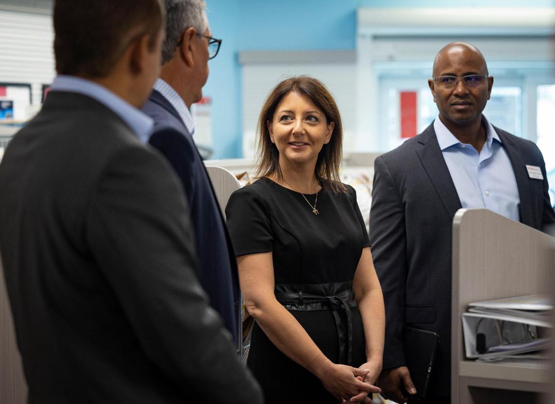 CDC Director Mandy Cohen, center, talks to pharmacy workers and CVS executives during a visit to CVS Pharmacy on Monday, Oct. 16, 2023, located on SW 40th Street in Miami.