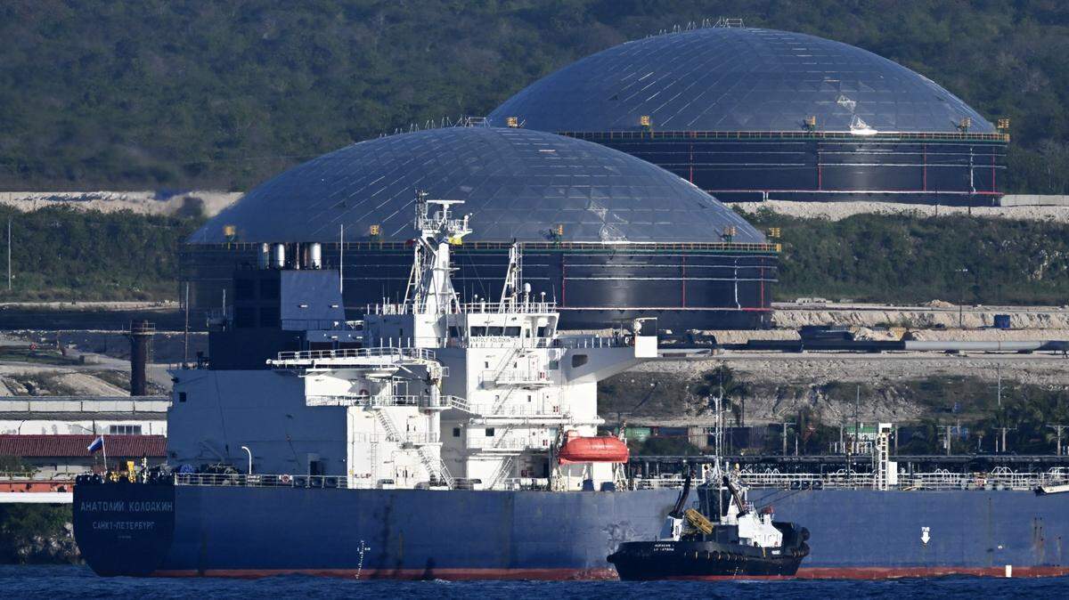A tugboat guides the Russian oil tanker Anatoly Kolodkin at the oil terminal in the port of Matanzas, northwestern Cuba, on March 31, 2026. The Anatoly Kolodkin, a tanker under US sanctions carrying 730,000 barrels of crude, is set to deliver the first crude shipment to Cuba since January after Washington gave the crisis-hit island a reprieve from an effective fuel blockade. 