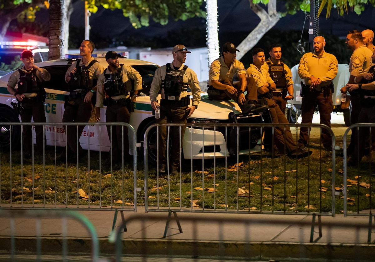 Miami-Dade County Police are seen across from Mango’s Tropical Cafe South Beach on Friday, March 24, 2023 in Miami Beach, Fla. After two deadly shootings, city officials voted not to re-impose a midnight curfew, but implemented an emergency order banning alcohol sales after 6 p.m.