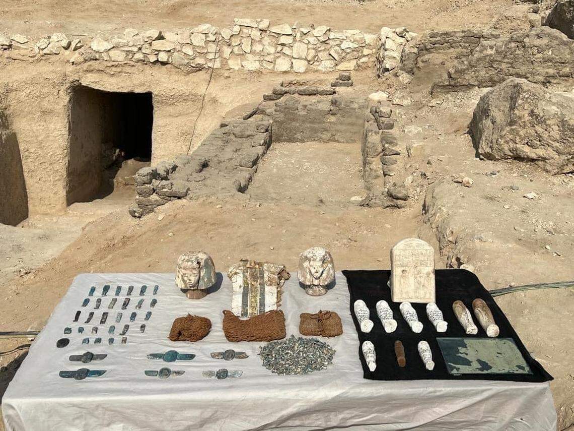 The funerary artifacts laid out on a table.