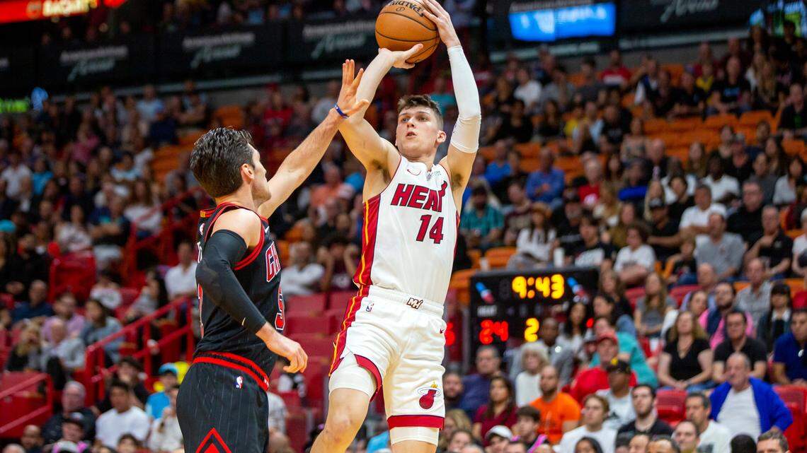 Miami Heat guard Tyler Herro (14) shoots the ball over Bulls guard Thomas Satoransky (31) during the second quarter the Heat’s Dec. 8 win against Chicago.