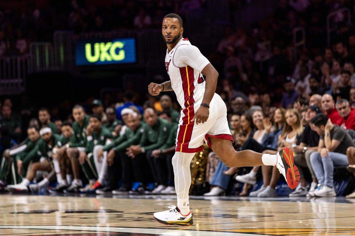 Miami Heat guard Norman Powell (24) reacts to hitting a shot during the first half of an preseason NBA game against the Milwaukee Bucks at Kaseya Center on October 6, 2025, in Miami.